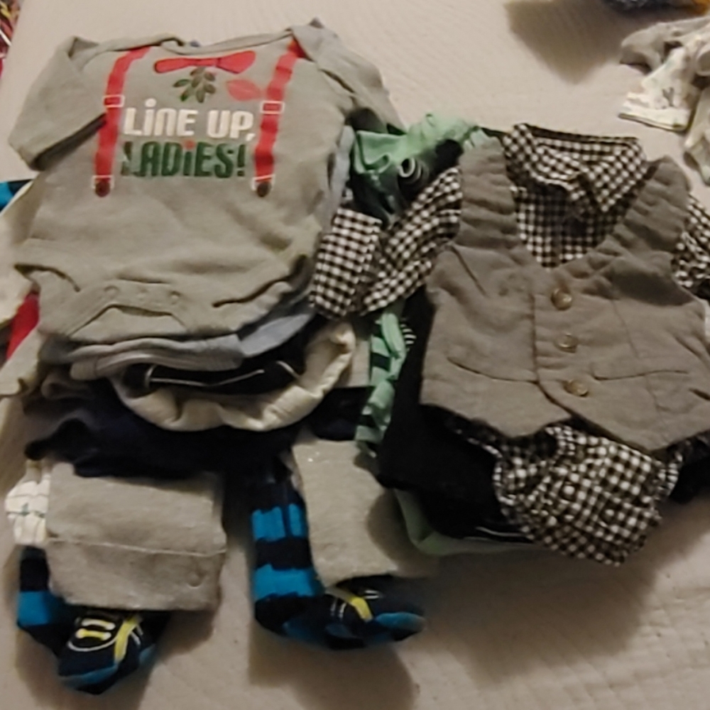 A variety of newborn baby boys clothes barely used